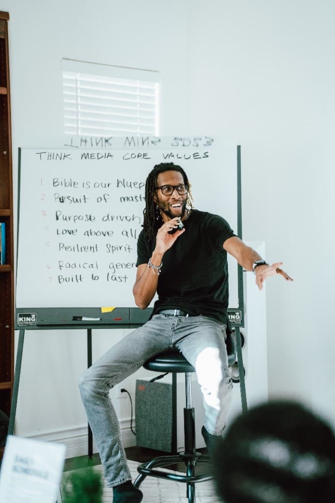 Geoffrey R. Crawford teaching marketing strategy at a whiteboard